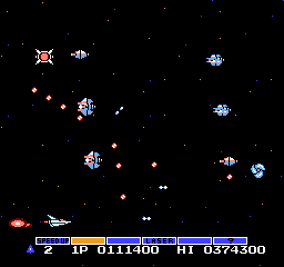 Gradius is known for its high level of difficulty. Pictured here is an instance of the game's internal 'rank'/'ranking' system—whenever your ship is stacked up with enough power-ups, enemy ships will begin firing additional stray bullets toward you.